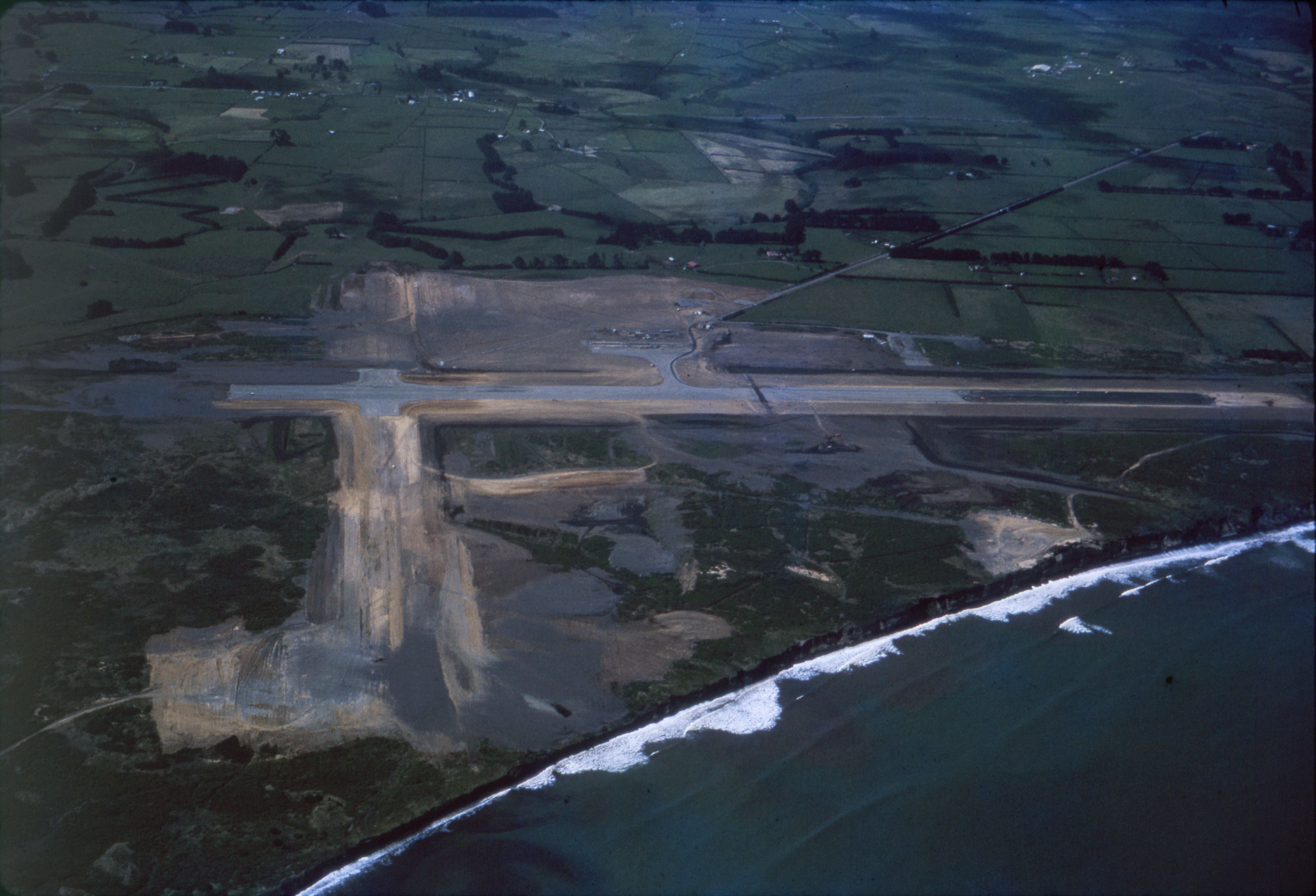 New Plymouth airport under construction in the 1960s with Brown Road on the right. Leslie Alexander Smith. Collection of Puke Ariki (PHO2015-0134).