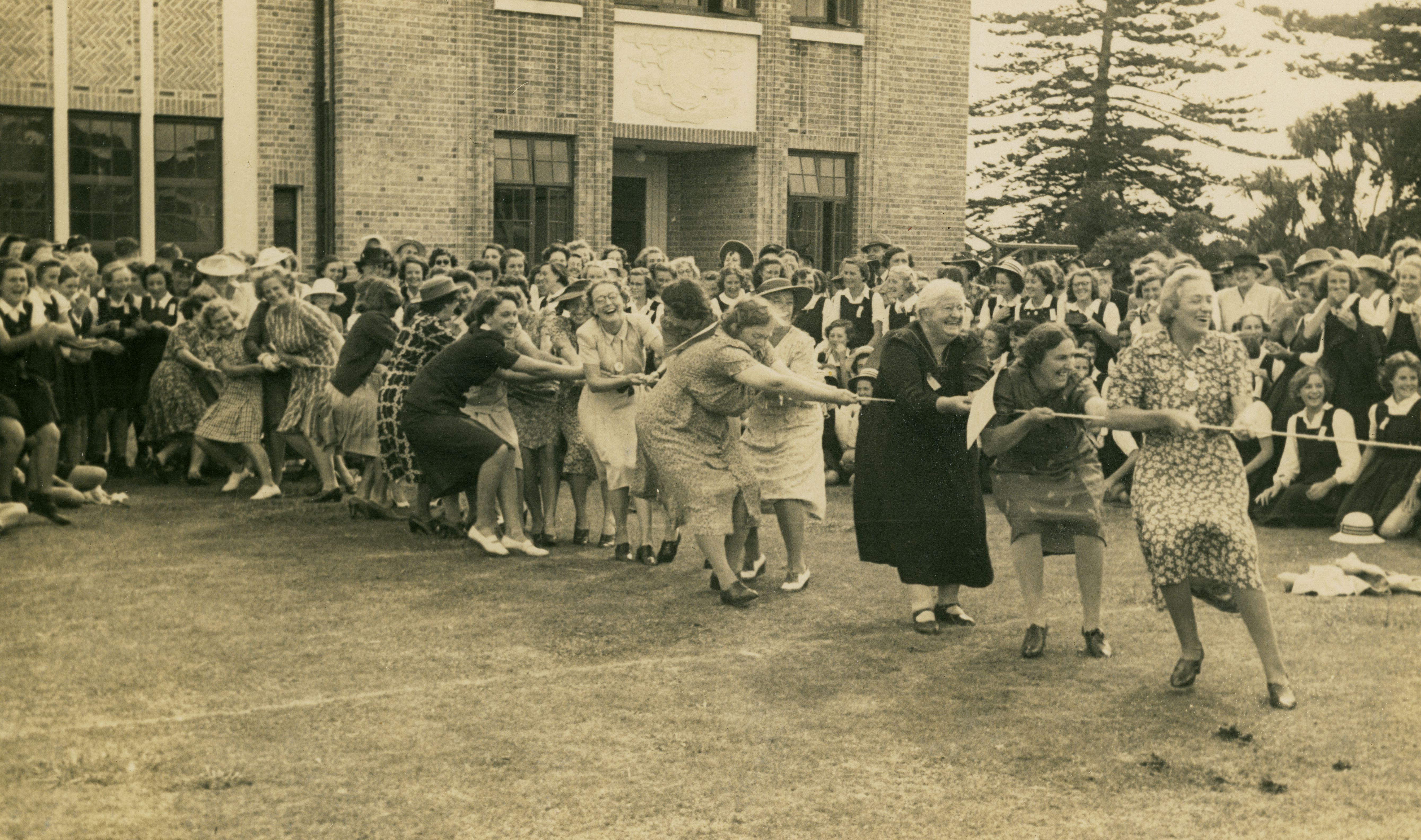 Elsie (second from right) at a New Plymouth Girl’s High School reunion with her aunt Elsie Andrews behind her in the tug of war. Crago Studios. Collection of Puke Ariki (PHO2010-0699).